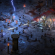 A Diablo II character lights up some skeletons in a crypt.